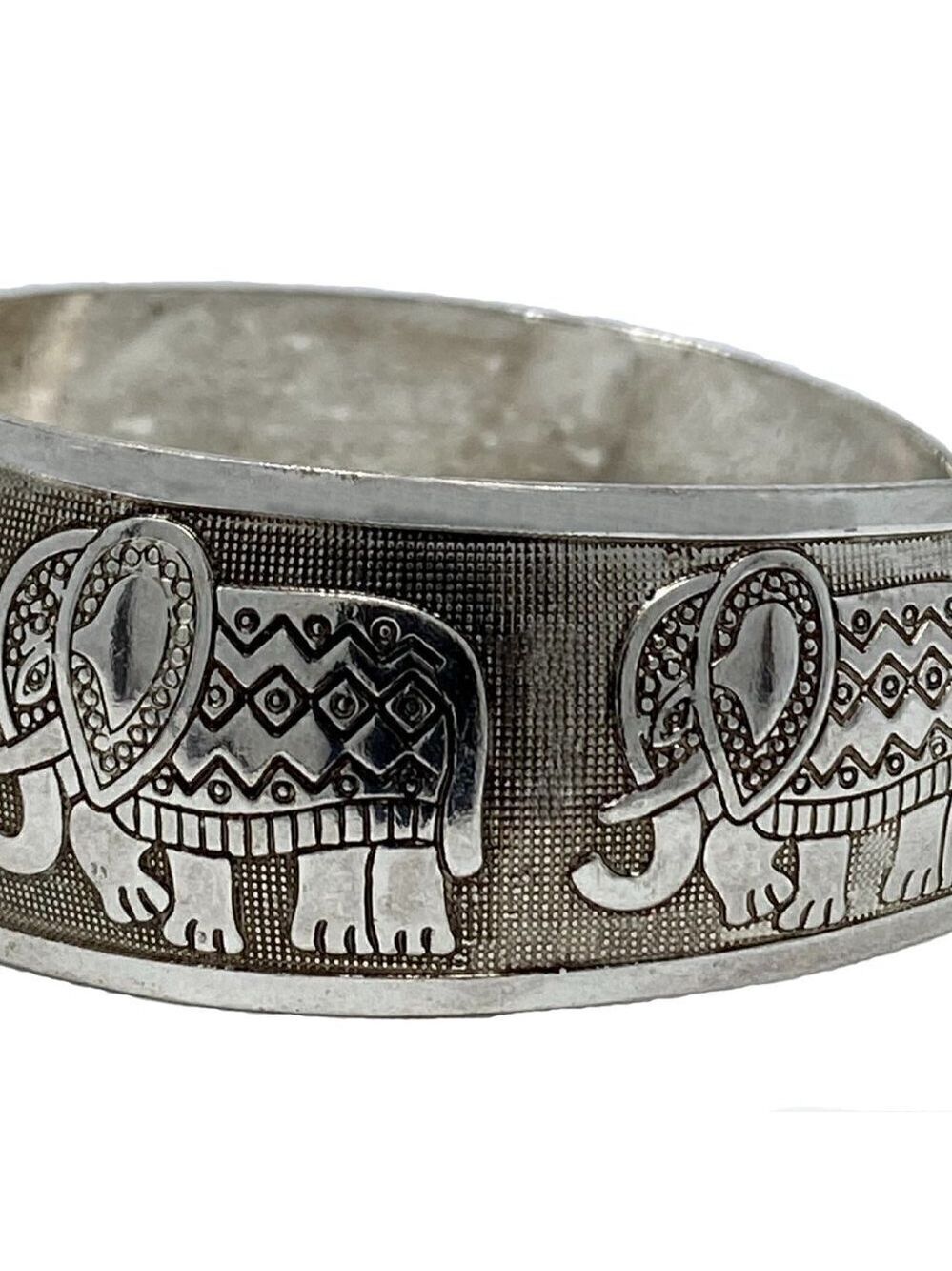 Chunky silver bracelet with marching elephants